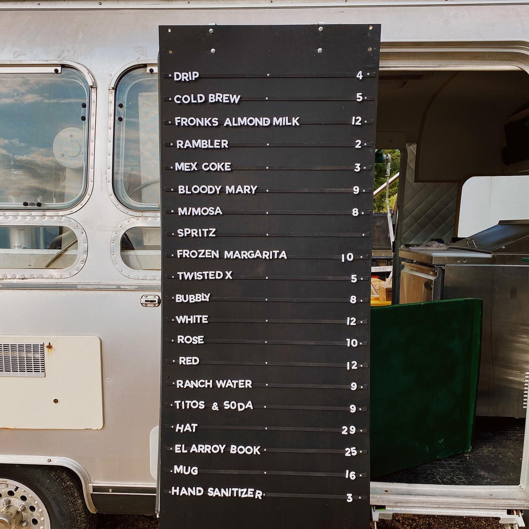 Magnetic Menu board with drink options in front of a food truck
