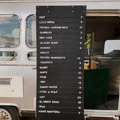 Magnetic Menu board with drink options in front of a food truck