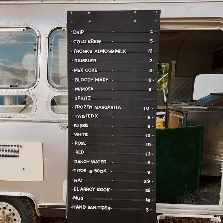 Magnetic Menu board with drink options in front of a food truck