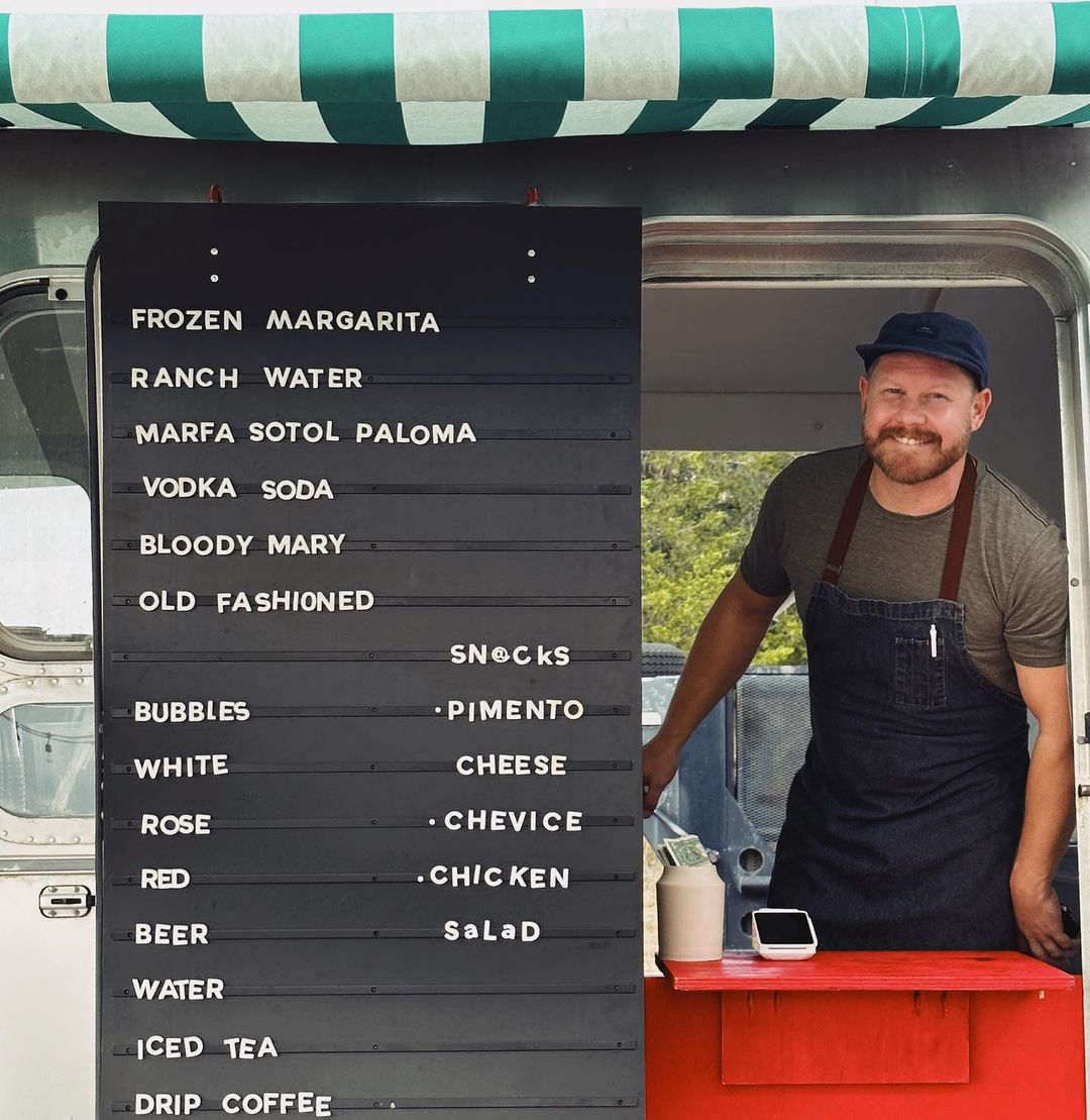 White Magnetic Letter Menu on a Airstream Door with a man taking orders