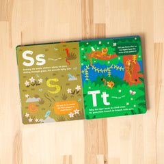 Open spread of 'Curious Creatures from A to Z' featuring S for Snake and T for Tiger.