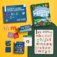 Animals A to Z Complete Educational Alphabet Bundle featuring, magnetic letters, alphabet storybook, memory matching game, alphabet flashcards, nano stickers, and mini magnetic wall decal on yellow background.